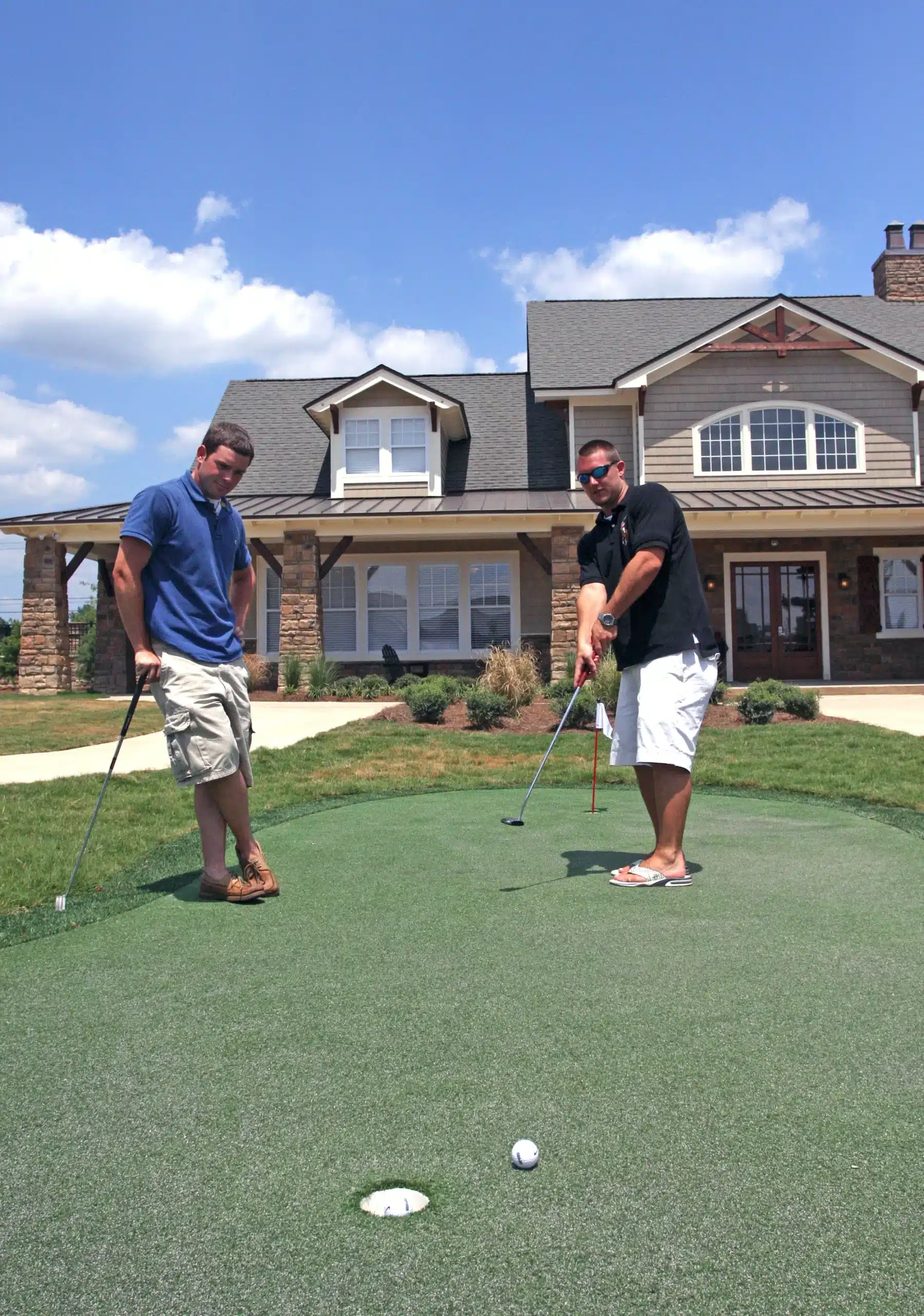 the retreat at columbia student apartments columbia sc putting green in front of clubhouse scaled